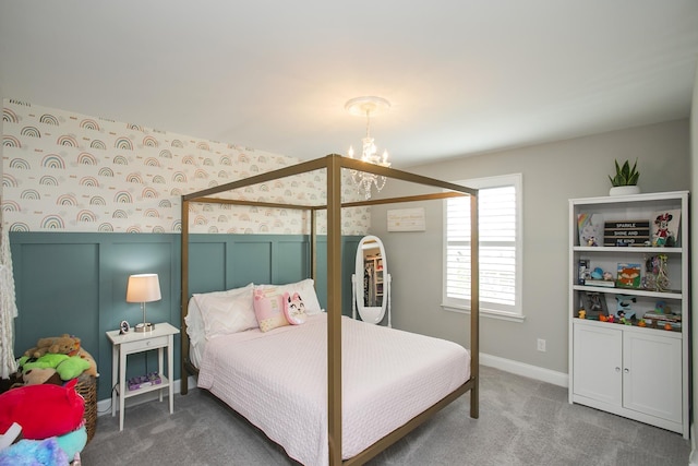 bedroom with carpet floors, a notable chandelier, and baseboards
