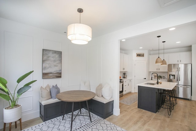 interior space featuring light wood finished floors and recessed lighting
