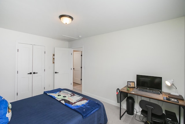 bedroom with a closet and baseboards