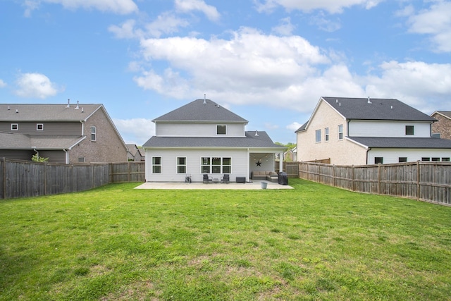back of property featuring a lawn, ceiling fan, a patio area, and a fenced backyard