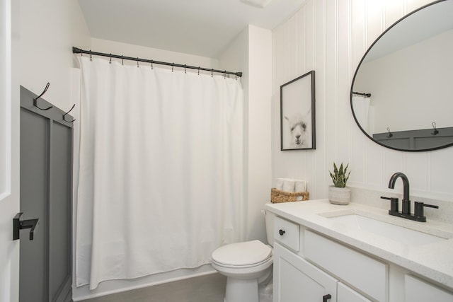 full bath featuring shower / bath combo, vanity, and toilet