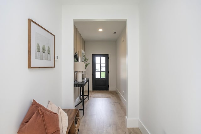 doorway to outside featuring recessed lighting, light wood-style floors, and baseboards