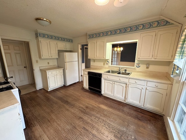 kitchen with black dishwasher, a sink, freestanding refrigerator, a chandelier, and a textured ceiling