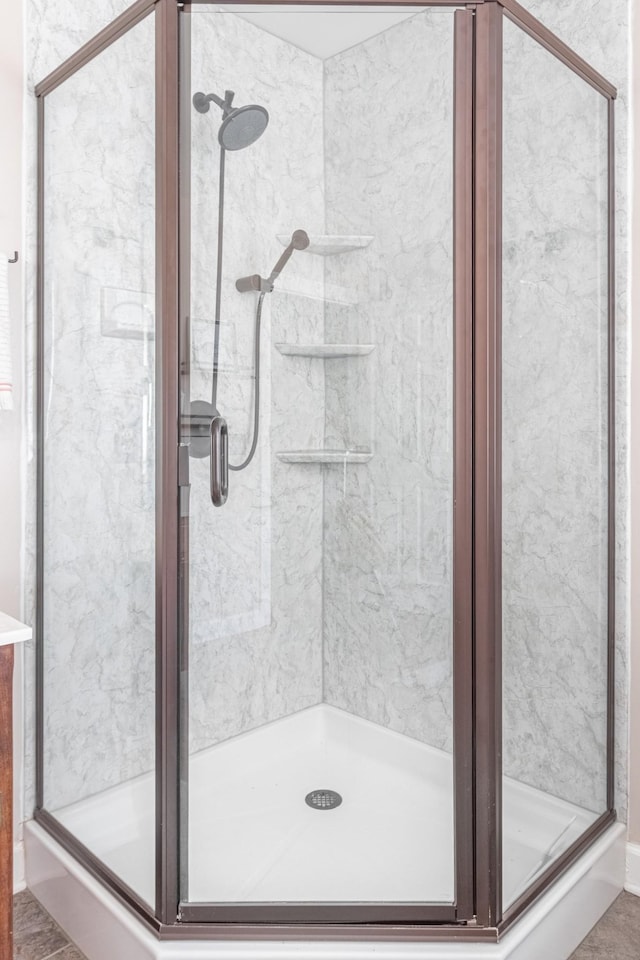 bathroom with a shower stall