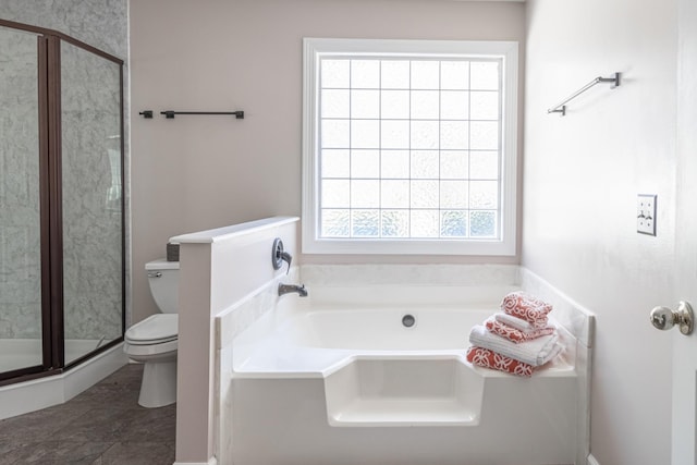 bathroom featuring toilet, a bath, and a shower stall