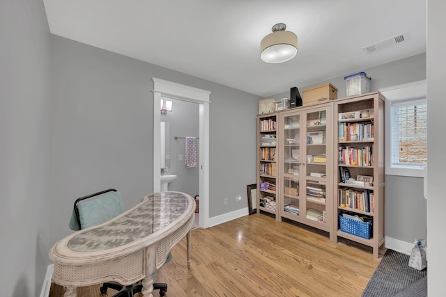 613 Chesterfield Way, Nashville, TN 37212 - living area featuring visible vents, light wood-style flooring, and baseboards