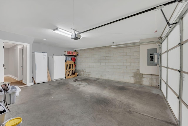 613 Chesterfield Way, Nashville, TN 37212 - garage with a garage door opener, freestanding refrigerator, electric panel, and concrete block wall