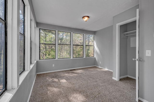 1425 Wesley Rd, Bon Aqua, TN 37025 - unfurnished bedroom featuring carpet flooring and baseboards