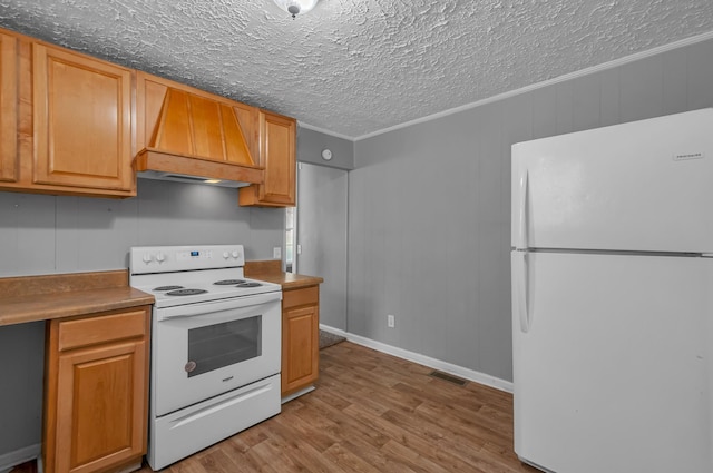1425 Wesley Rd, Bon Aqua, TN 37025 - kitchen featuring custom exhaust hood, white appliances, a textured ceiling, visible vents, and wood finished floors