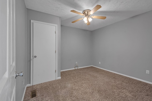 1425 Wesley Rd, Bon Aqua, TN 37025 - spare room featuring carpet flooring, visible vents, baseboards, and ceiling fan