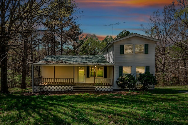 1425 Wesley Rd, Bon Aqua, TN 37025 - back of house featuring a porch and a yard