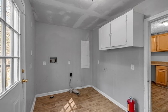 1425 Wesley Rd, Bon Aqua, TN 37025 - laundry room featuring cabinet space, hookup for a washing machine, electric panel, and a healthy amount of sunlight