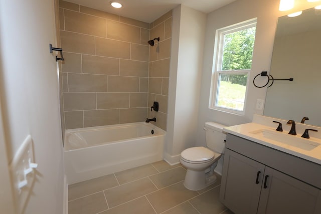 full bath featuring tile patterned floors, vanity,  shower combination, baseboards, and toilet
