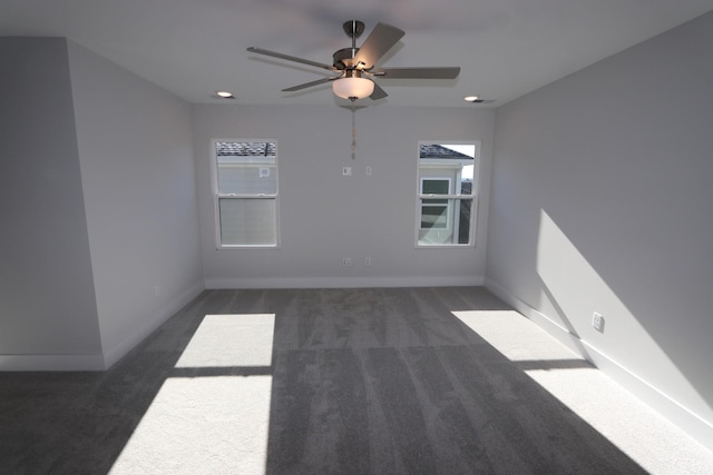 unfurnished room featuring baseboards, dark carpet, recessed lighting, and ceiling fan