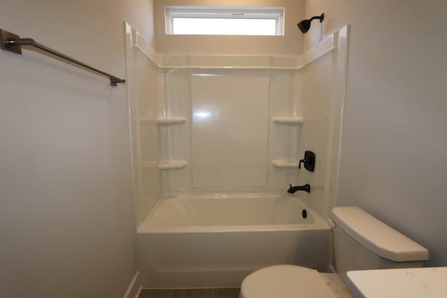 full bath featuring toilet and shower / washtub combination