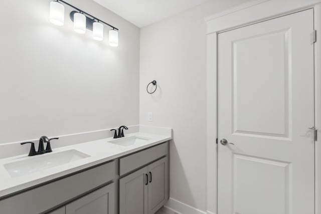 7930 Pine St, Fairview, TN 37062 - bathroom featuring double vanity, baseboards, and a sink
