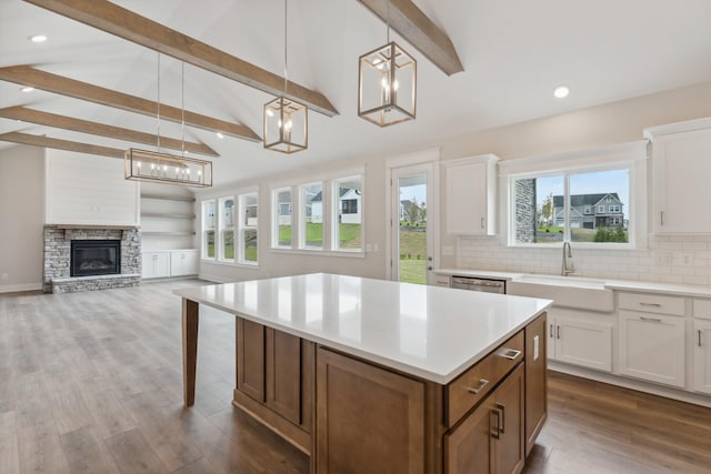 7930 Pine St, Fairview, TN 37062 - kitchen with a center island, dishwasher, light countertops, and white cabinetry