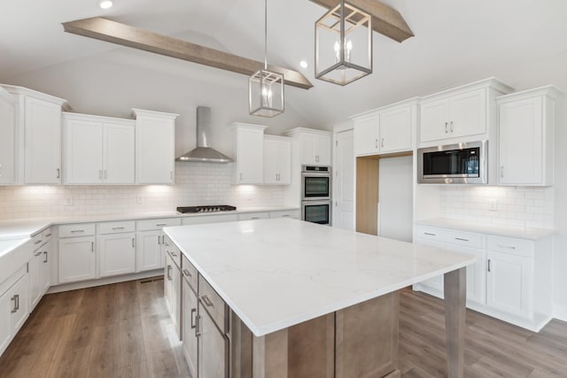 7930 Pine St, Fairview, TN 37062 - kitchen with wall chimney range hood, a kitchen island, lofted ceiling with beams, and appliances with stainless steel finishes