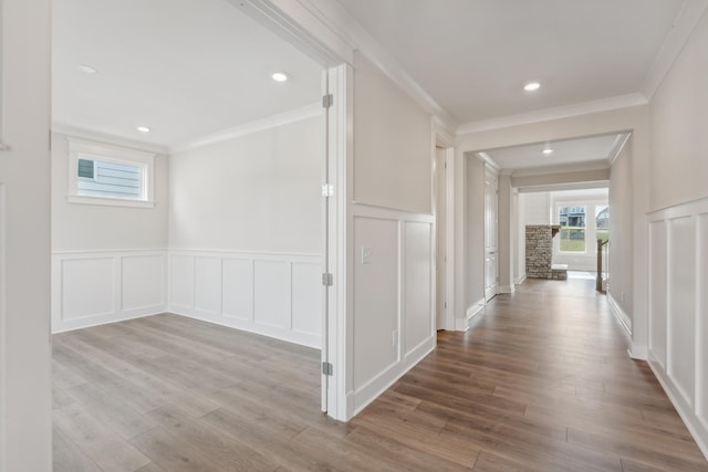 7930 Pine St, Fairview, TN 37062 - hall featuring wainscoting, a decorative wall, wood finished floors, and ornamental molding