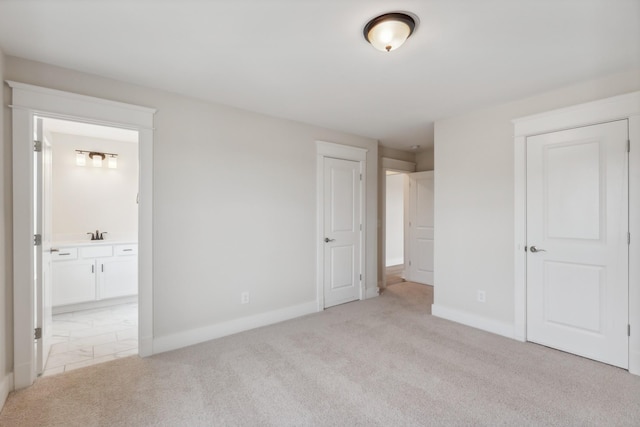 7930 Pine St, Fairview, TN 37062 - unfurnished bedroom featuring ensuite bath, baseboards, light colored carpet, and a sink