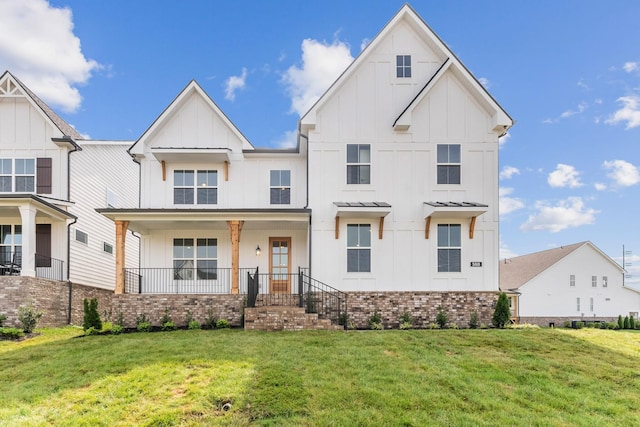 7930 Pine St, Fairview, TN 37062 - modern farmhouse featuring board and batten siding, a front yard, and brick siding