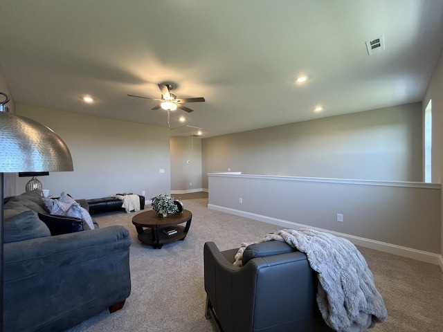 carpeted living area featuring visible vents, baseboards, a ceiling fan, and recessed lighting