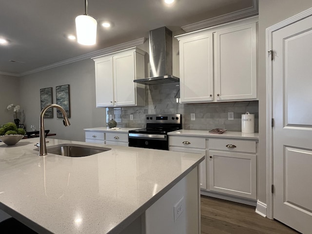 kitchen featuring wall chimney range hood, backsplash, electric range, crown molding, and a sink