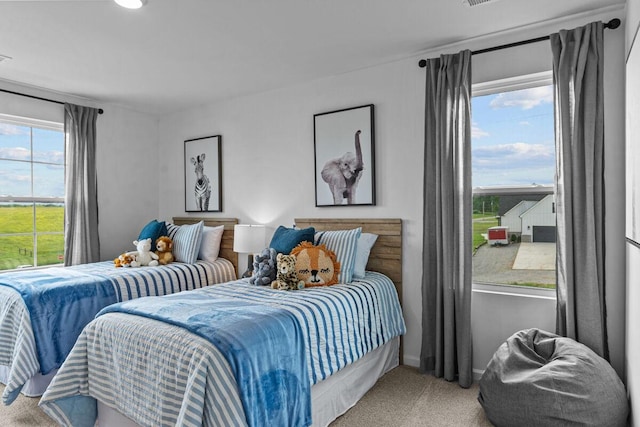 carpeted bedroom featuring baseboards