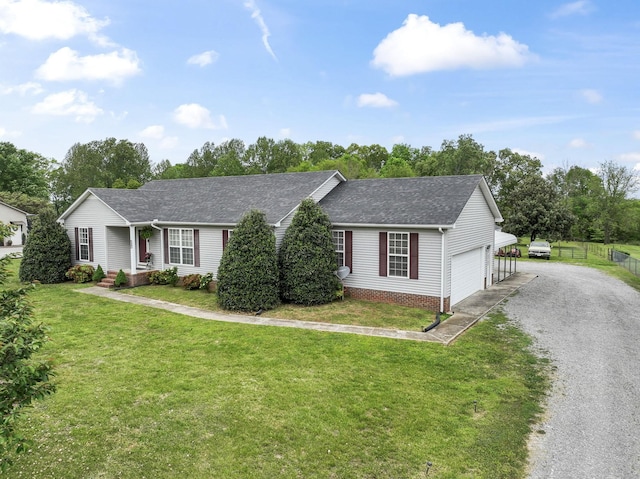 ranch-style house featuring a garage, a front lawn, fence, a shingled roof, and driveway