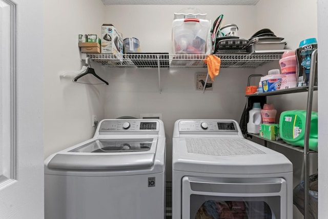 laundry room featuring laundry area and washing machine and clothes dryer