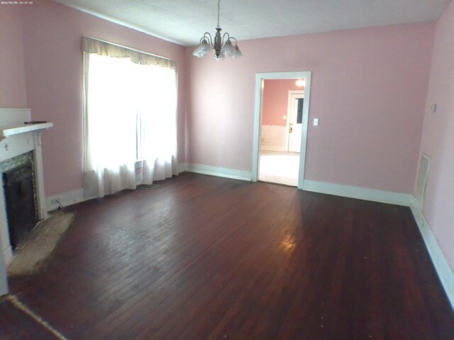 201 Hodges St N, Cowan, TN 37318 - unfurnished living room with dark wood-type flooring, a chandelier, and a premium fireplace