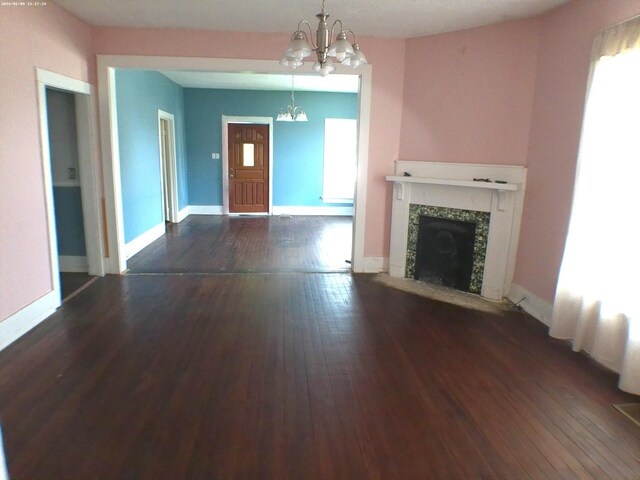 201 Hodges St N, Cowan, TN 37318 - unfurnished living room with a chandelier, hardwood / wood-style flooring, and a fireplace