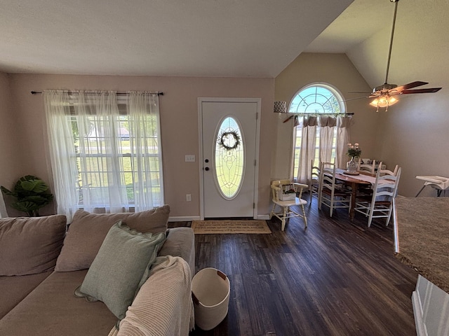 foyer with ceiling fan, baseboards, wood finished floors, and lofted ceiling