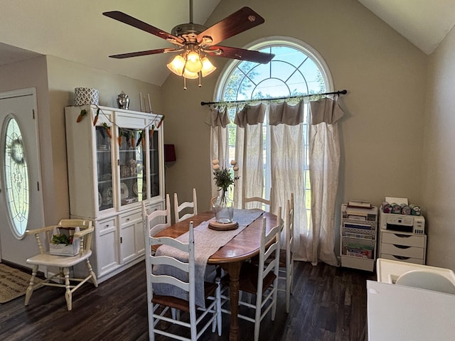 dining room featuring dark wood-type flooring, ceiling fan, and vaulted ceiling