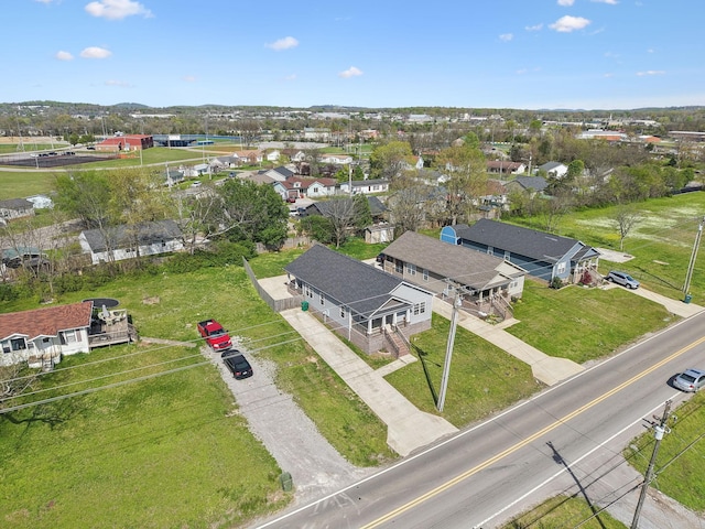 birds eye view of property with a residential view
