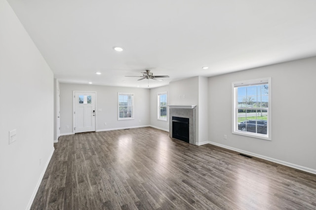 unfurnished living room with recessed lighting, dark wood-style floors, baseboards, and ceiling fan
