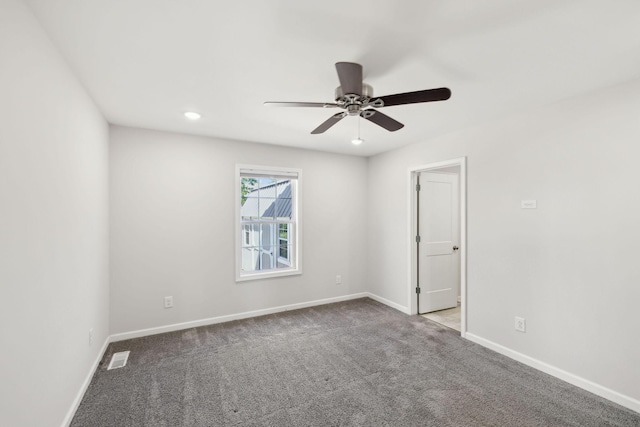 spare room featuring ceiling fan, visible vents, recessed lighting, carpet floors, and baseboards