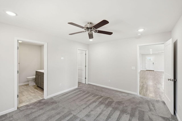 unfurnished bedroom featuring recessed lighting, carpet, and baseboards