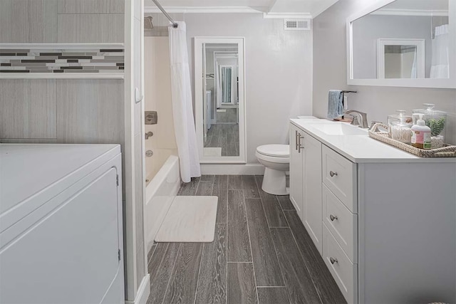 4712 Miners Cv, Antioch, TN 37013 - full bath with shower / bath combo, toilet, wood tiled floor, vanity, and washer / dryer