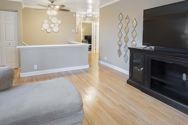 4712 Miners Cv, Antioch, TN 37013 - living area featuring light wood-type flooring, crown molding, a ceiling fan, and baseboards