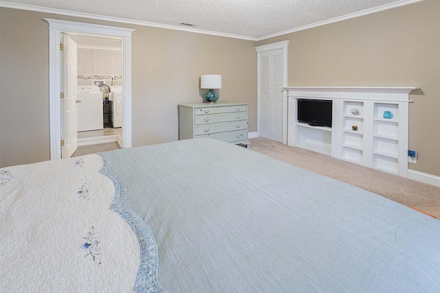 4712 Miners Cv, Antioch, TN 37013 - bedroom featuring visible vents, a closet, ornamental molding, a textured ceiling, and washing machine and dryer