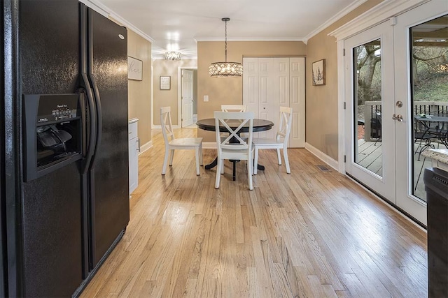 4712 Miners Cv, Antioch, TN 37013 - dining room with crown molding, light wood finished floors, baseboards, and a notable chandelier