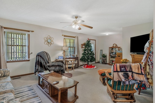 4801 Old Shelbyville Rd, Tullahoma, TN 37388 - carpeted living room with a textured ceiling, visible vents, a ceiling fan, and baseboards