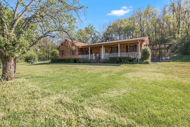 4801 Old Shelbyville Rd, Tullahoma, TN 37388 - ranch-style house with brick siding, a sunroom, a porch, and a front lawn