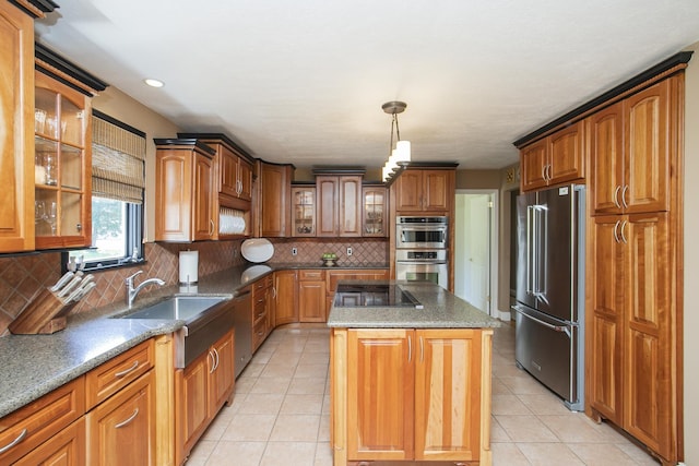 1035 Forest Harbor Dr, Hendersonville, TN 37075 - kitchen with a sink, brown cabinetry, a center island, and appliances with stainless steel finishes