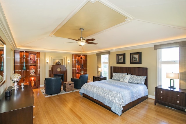 1035 Forest Harbor Dr, Hendersonville, TN 37075 - bedroom featuring a fireplace, multiple windows, ornamental molding, and wood finished floors