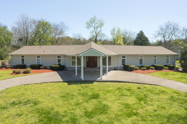 1035 Forest Harbor Dr, Hendersonville, TN 37075 - single story home with a front yard, a carport, stone siding, concrete driveway, and stucco siding
