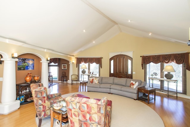 1035 Forest Harbor Dr, Hendersonville, TN 37075 - living area with ornate columns, arched walkways, lofted ceiling, and light wood finished floors