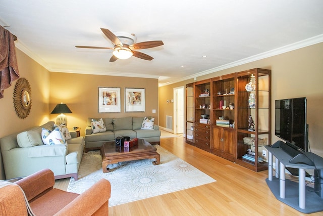 1035 Forest Harbor Dr, Hendersonville, TN 37075 - living room featuring light wood-style floors, ceiling fan, ornamental molding, and visible vents