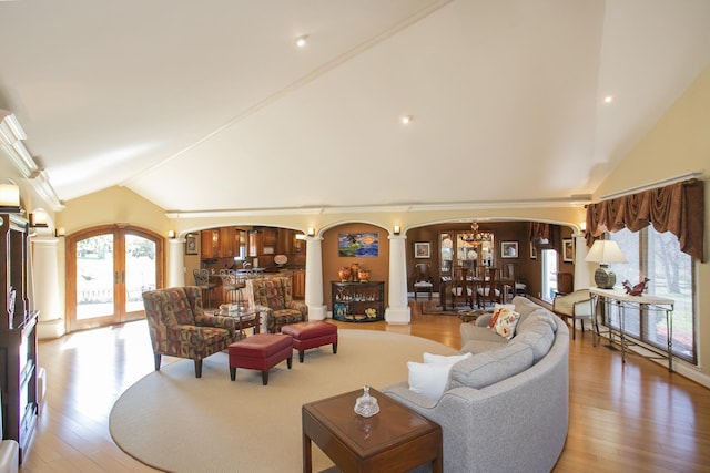 1035 Forest Harbor Dr, Hendersonville, TN 37075 - living area featuring light wood-style flooring, decorative columns, arched walkways, and lofted ceiling